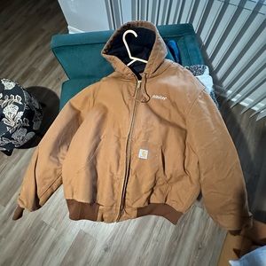 Large Carhartt work jacket. Still stiff bc such few usage.